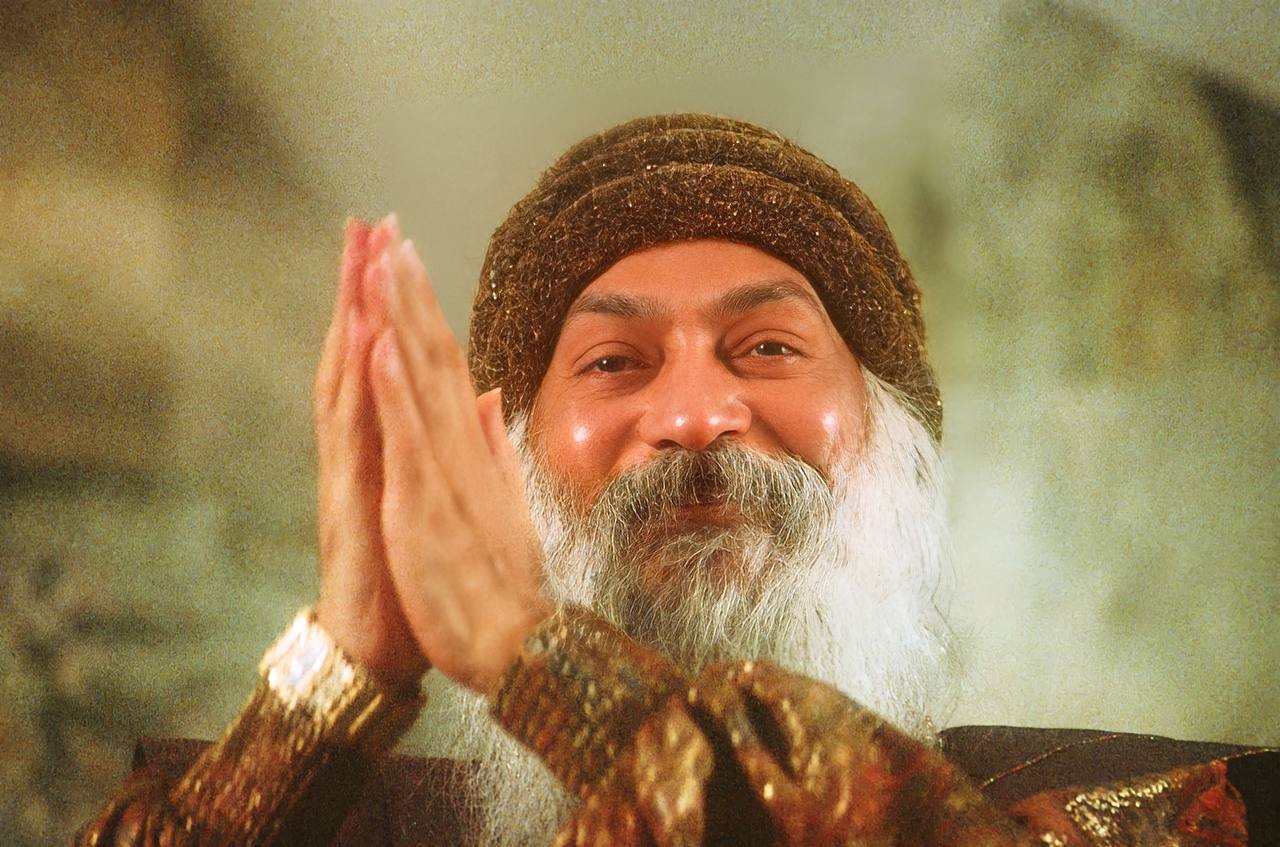 Osho dancing and smiling